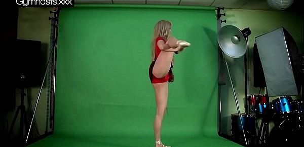  Red Dressed Gymnast Doing Spreads